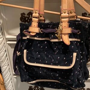 Juicy Couture Black with leather Cream trimmings and straps